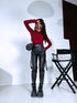 Black faux leather pants with zippers at the ends