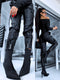Black faux leather pants with zippers at the ends