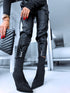 Black faux leather pants with zippers at the ends