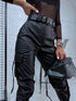 Black faux leather pants with zippers at the ends
